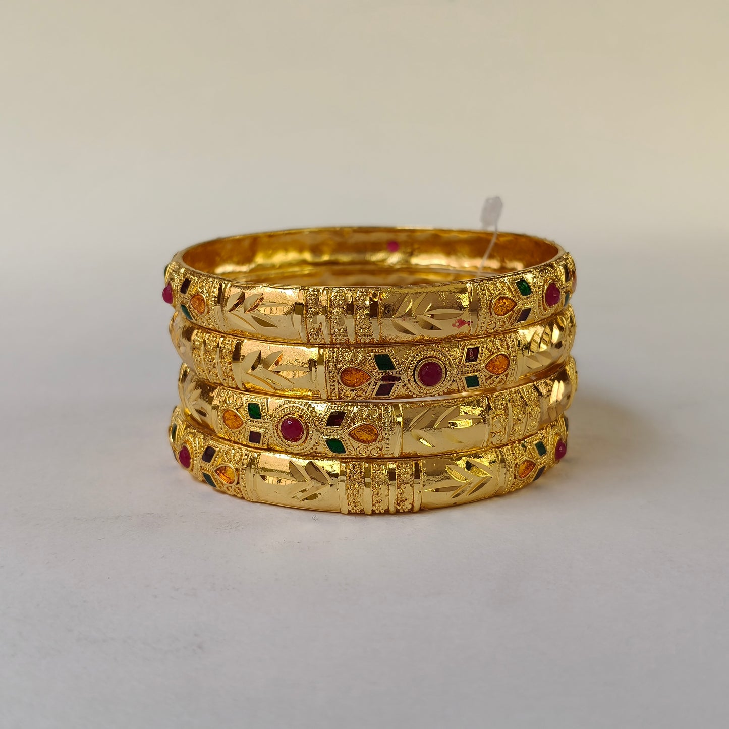 Gold Toned Multi-Stone Engraved Bangles