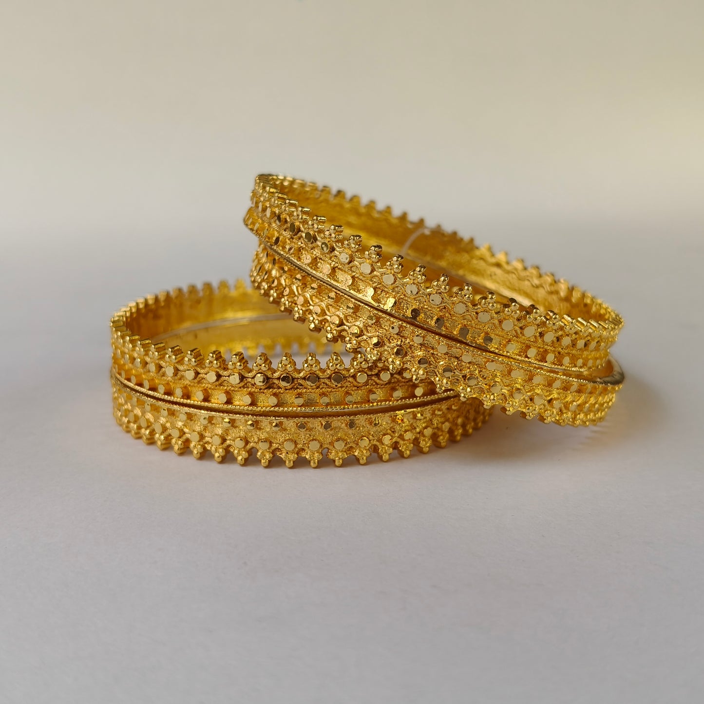 Textured Gold Toned Serrated Bangles