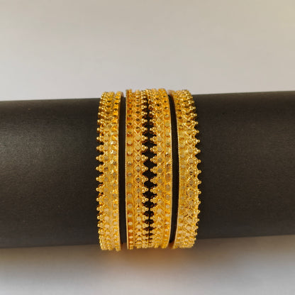 Textured Gold Toned Serrated Bangles