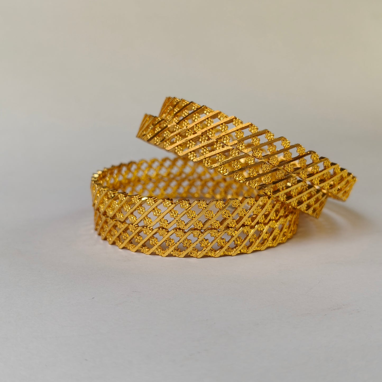Geometric Intertwined Gold Textured Bangles - 3 Flowered