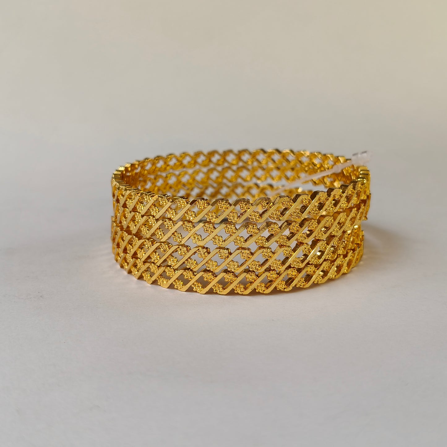 Geometric Intertwined Gold Textured Bangles - 2 Flowered